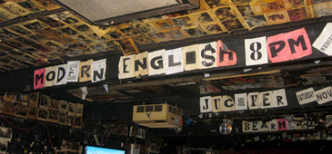 Modern English sign inside The Nick Rocks venue