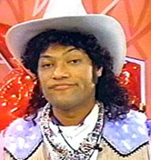 Cowboy Curtis, "You know what they say, big feet...big boots!"