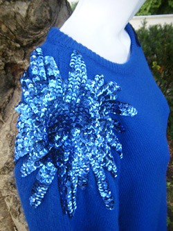 Blue sweater dress with sequence bursts on the shoulders (photo credit: VinTaGeOus)