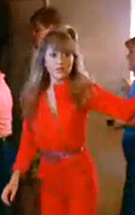 E.G. Daily wearing a red jumpsuit in "Valley Girl"