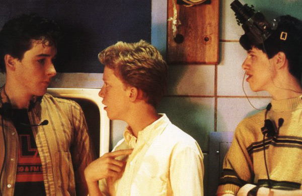 Farmer Ted conversing with the other geeks of "Sixteen Candles"